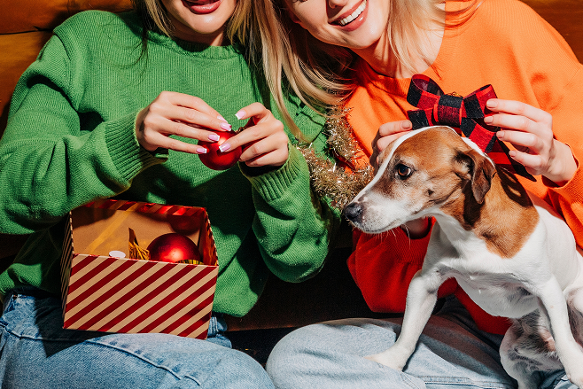 two people with a dog.